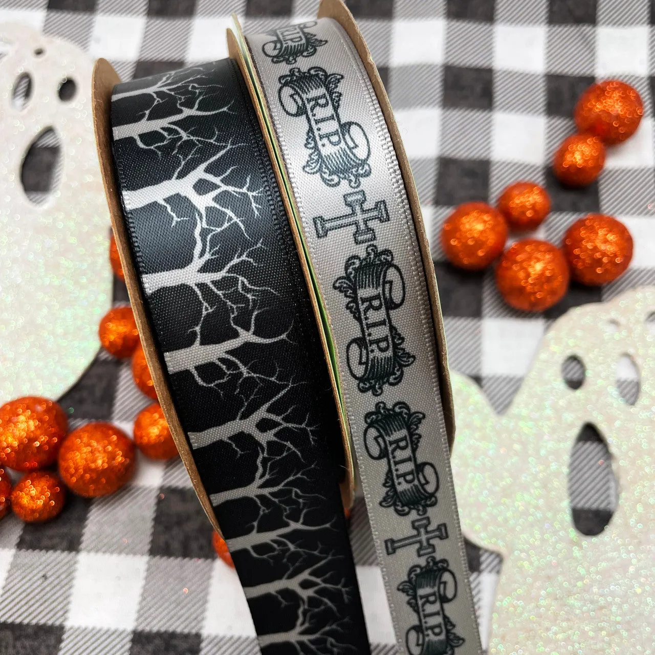 Spooky tree ribbon with silver leafless branches on a black background printed on 7/8" silver satin